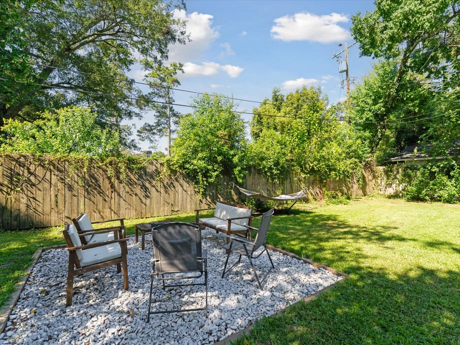 Tree-lined street with a classic bungalow in the Daffin Park area of Midtown Savannah, GA