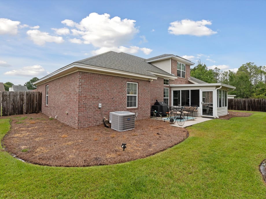 A home in the Godley Station and Pooler, GA area on a sidewalk-lined street