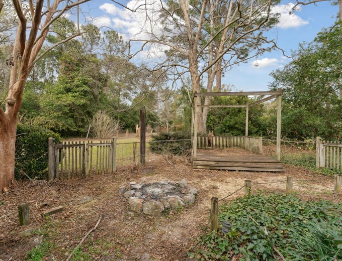 Spacious backyard with mature trees at a Rincon, GA home